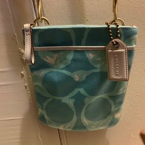 Turquoise Coach logo print white leather detailing